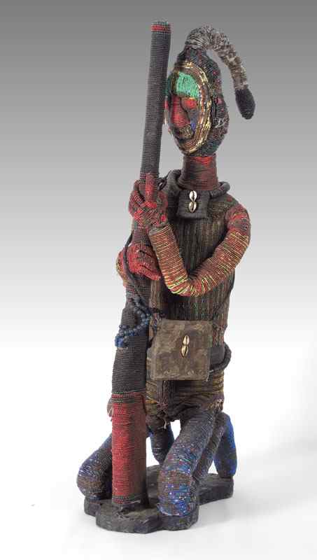 Appraisal: CARVED AFRICAN CAMEROON BEADED HUNTER LBS '' x '' x