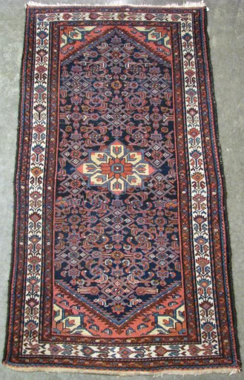 Appraisal: Handmade Oriental Area Rug Kazak design navy field with red