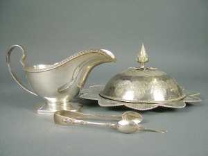 Appraisal: A silver sauce boat Sheffield with hexagonal foot and c-scroll