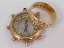 Appraisal: A hallmarked carat gold '' ship's wheel '' compass Chester