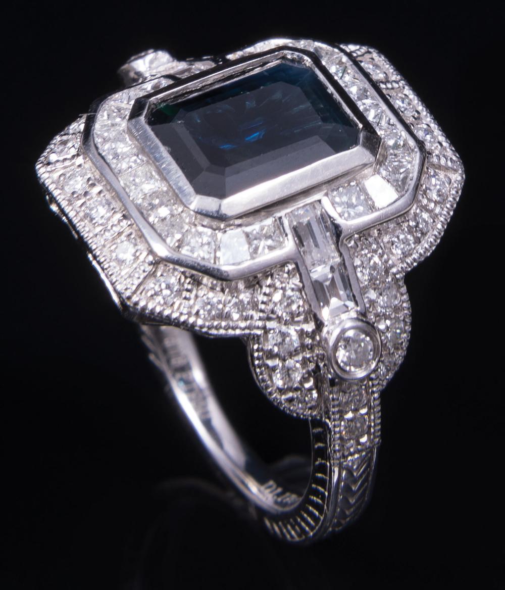 Appraisal: Platinum Sapphire and Diamond Ring center bezel set emerald-cut sapphire