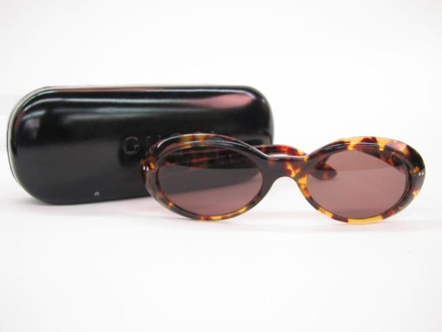 Appraisal: Gucci tortoise shell frame sunglasses with oval lenses in hard