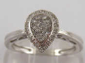 Appraisal: A carat white gold ring with pave set diamond pear