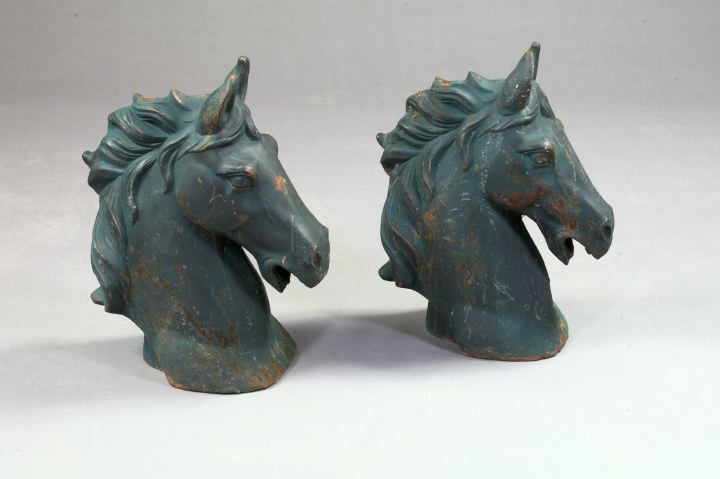 Appraisal: Pair of Cast-Iron Horse Heads each in a patinated black