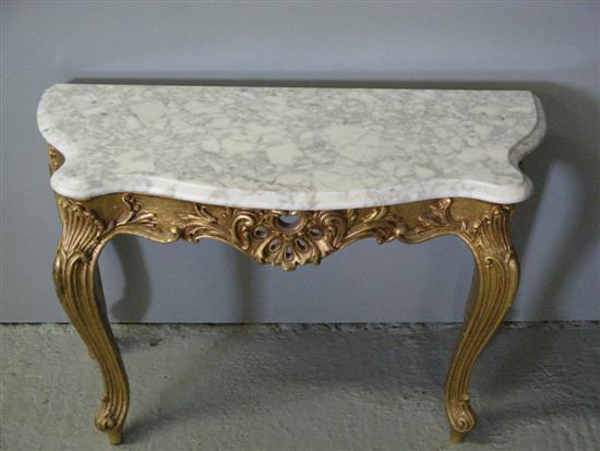 Appraisal: Twentieth century serpentine shaped marble topped gilt side table on