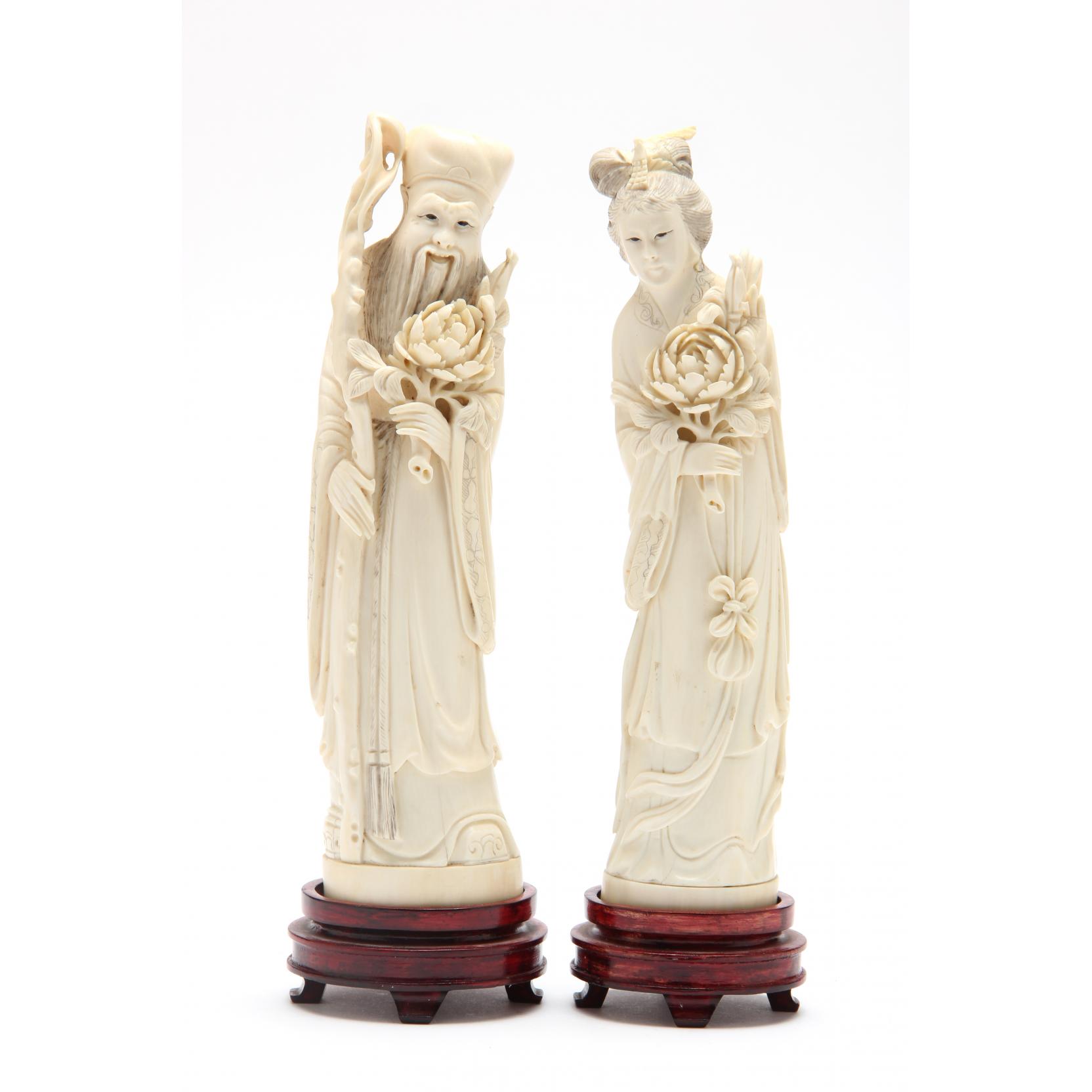 Appraisal: A Pair of Chinese Ivory Daoist Immortal Figures th century