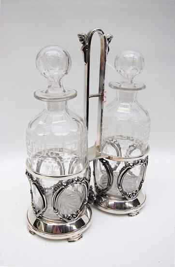 Appraisal: AMERICAN VICTORIAN DECANTER SET AND STAND pair of cut and