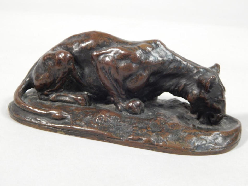 Appraisal: An early thC bronze figure of a drinking lioness stamped