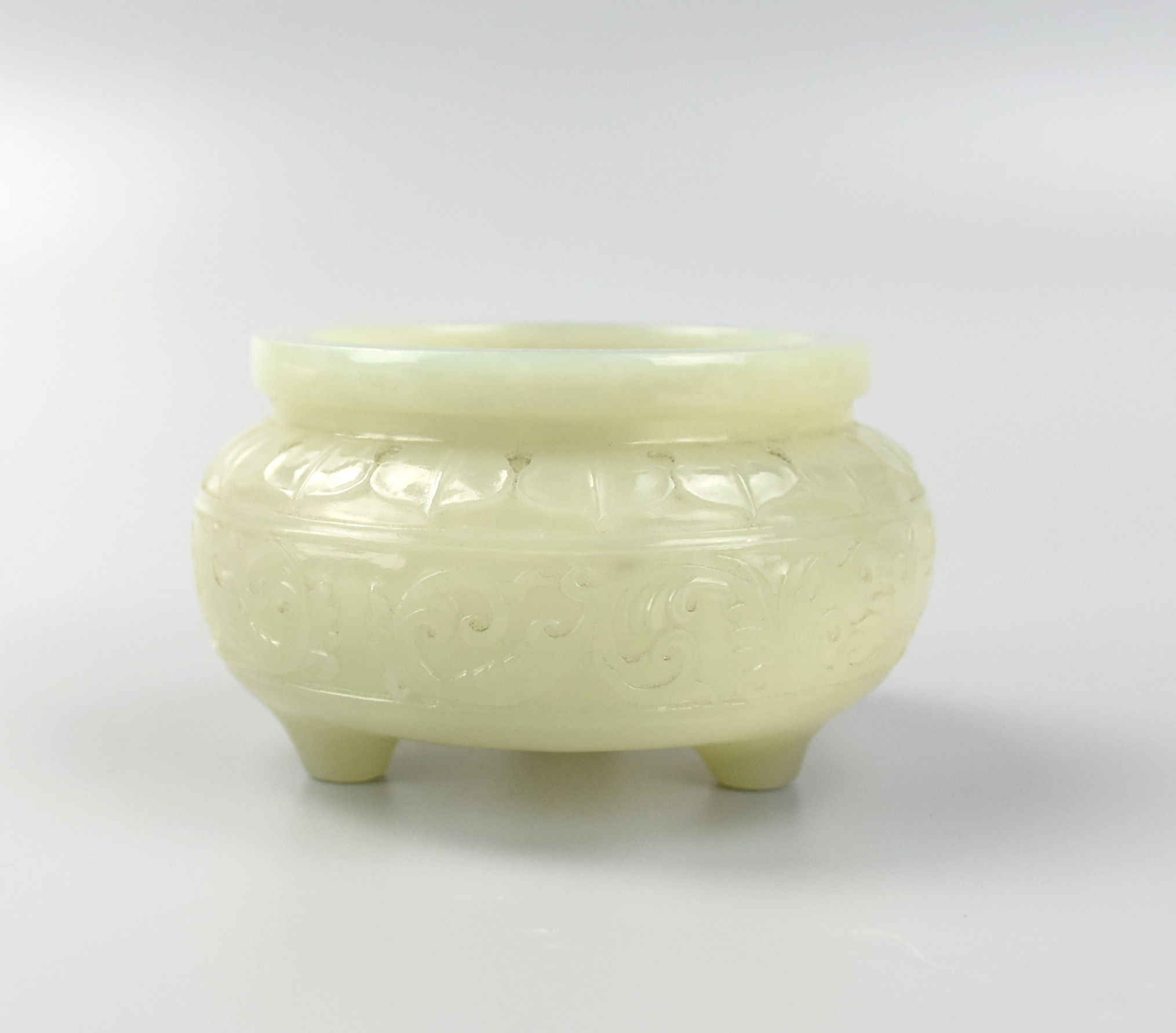 Appraisal: CHINESE PALE GREEN JADE TRIPOD CENSER Chinese the compressed spherical