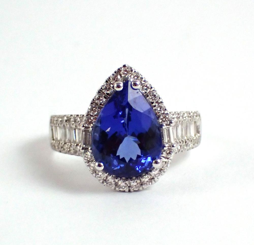 Appraisal: TANZANITE DIAMOND AND FOURTEEN KARAT WHITE GOLD RING with round-cut