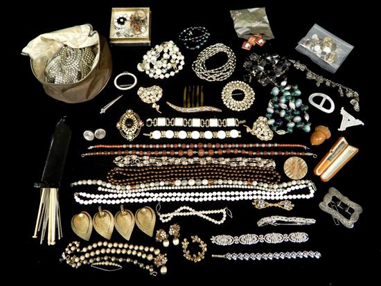 Appraisal: JEWELRY Assorted costume jewelry pieces including Bakelite cigarette holder in