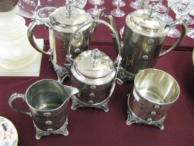 Appraisal: Meriden Victorian Silverplate Tea Coffee Service footed floral design teapot