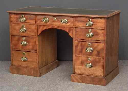 Appraisal: A Victorian satin birch kneehole dressing table the crossbanded top