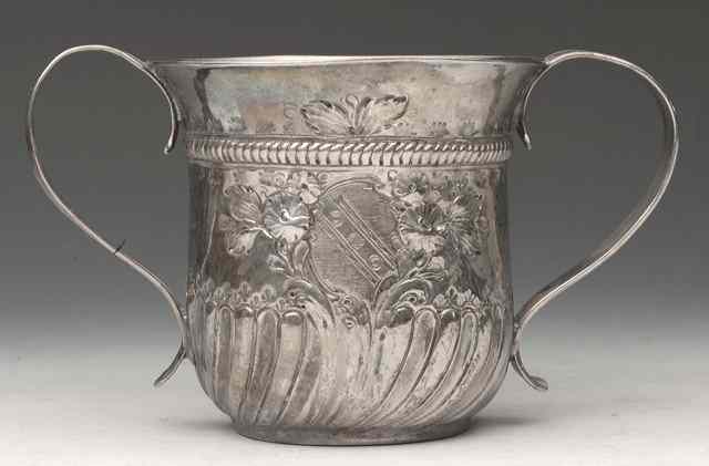 Appraisal: A GEORGE III SILVER PORRINGER with wrythen lower body later