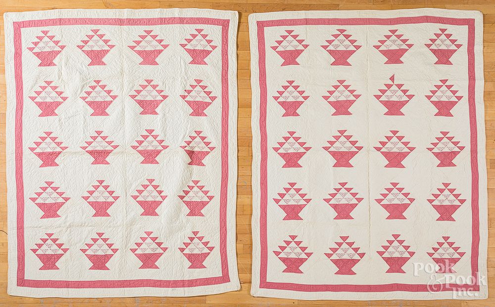 Appraisal: Pair of pink and white basket quilts Pair of pink