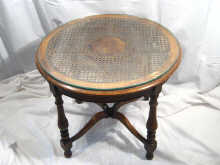 Appraisal: An oak occasional table having a cane top with burr