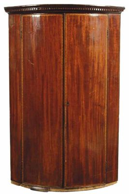 Appraisal: A George III mahogany bowfront hanging corner cupboard the pair