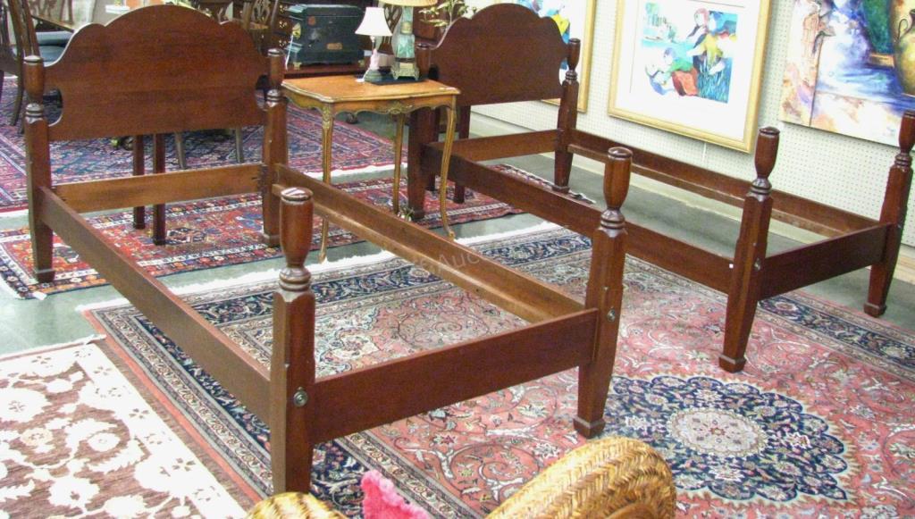 Appraisal: A pair of cherry twin-size bed frames by Harden furniture