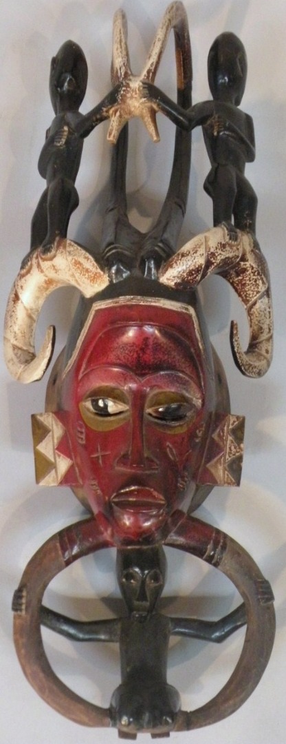 Appraisal: An Ivory Coast Baoule wooden tribal mask with carved figures