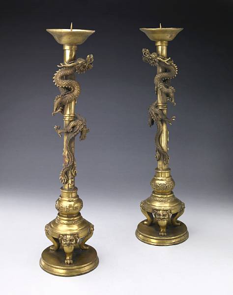 Appraisal: A pair of chinoiserie decorated bronze candlesticks th century Each