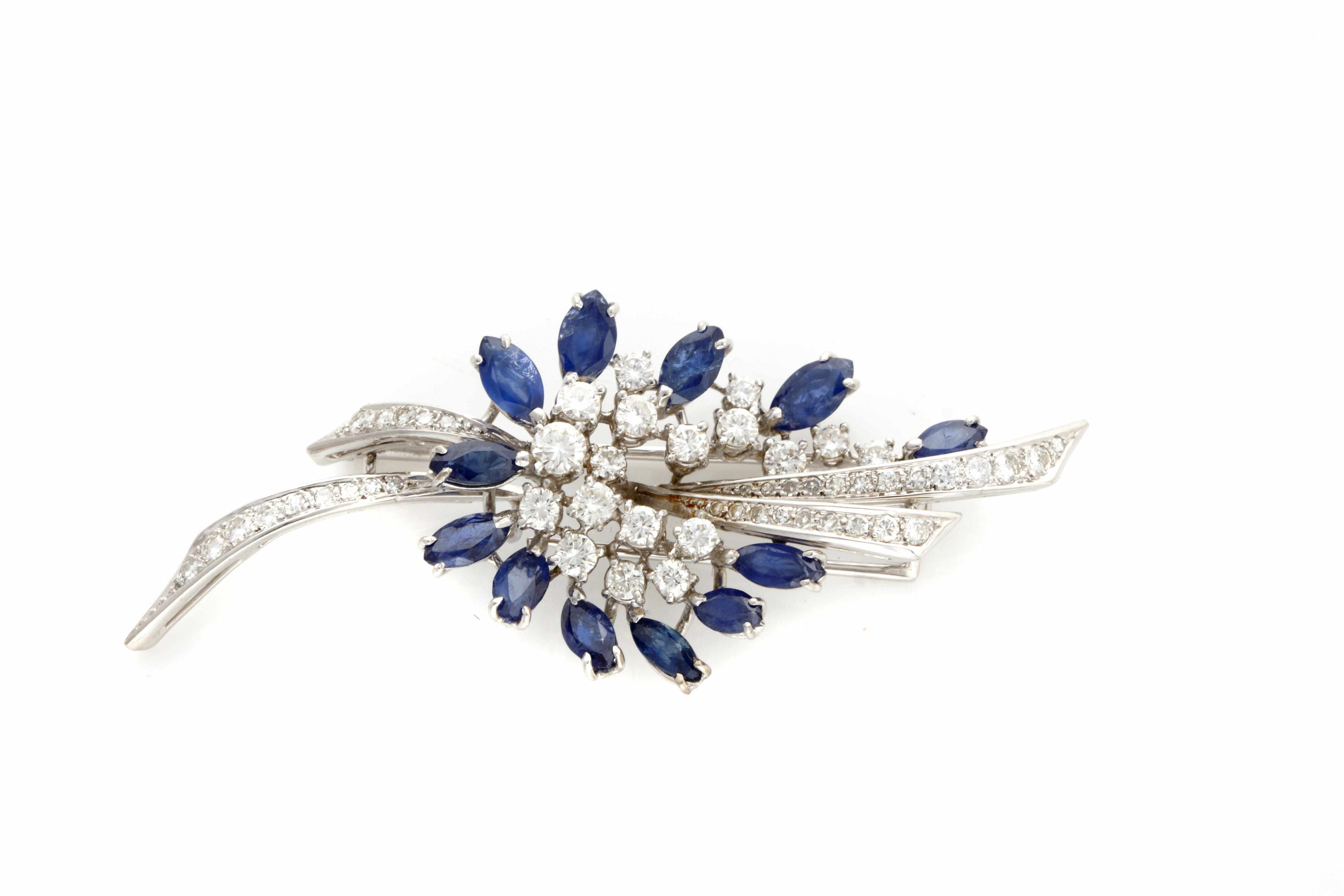 Appraisal: A diamond sapphire and k white gold spray brooch estimated