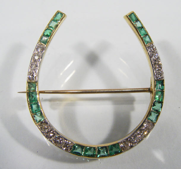 Appraisal: ct diamond and emerald horseshoe brooch approx ct