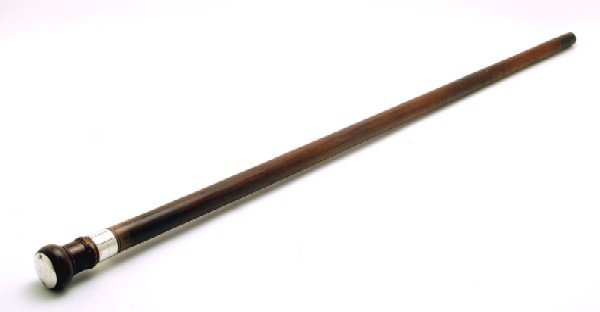 Appraisal: Walking stick of wood with turned top metal band at