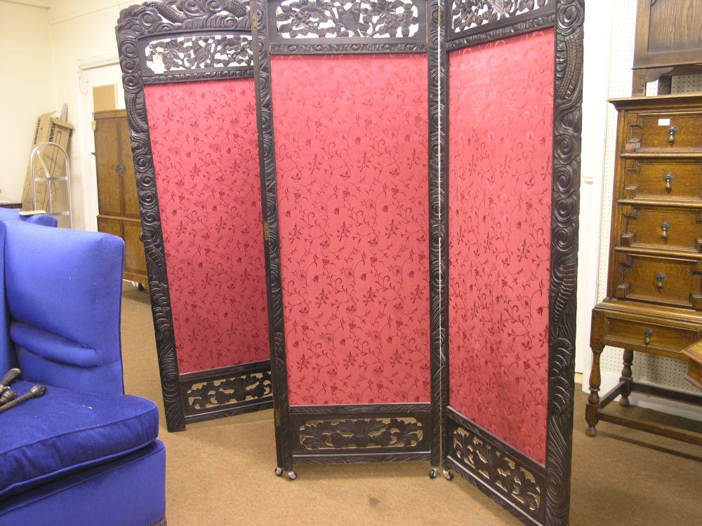 Appraisal: A Chinese carved wood screen folding in four sections and