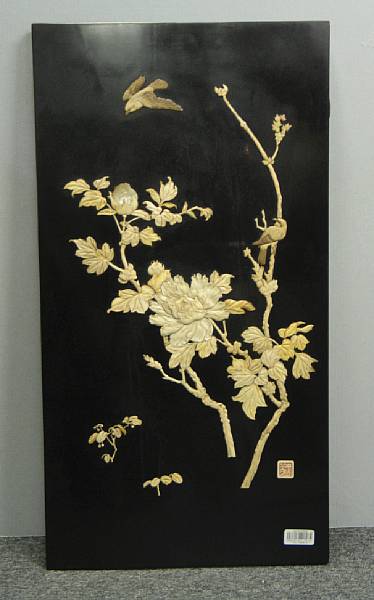 Appraisal: A black lacquered wood wall panel With overlaid decoration of