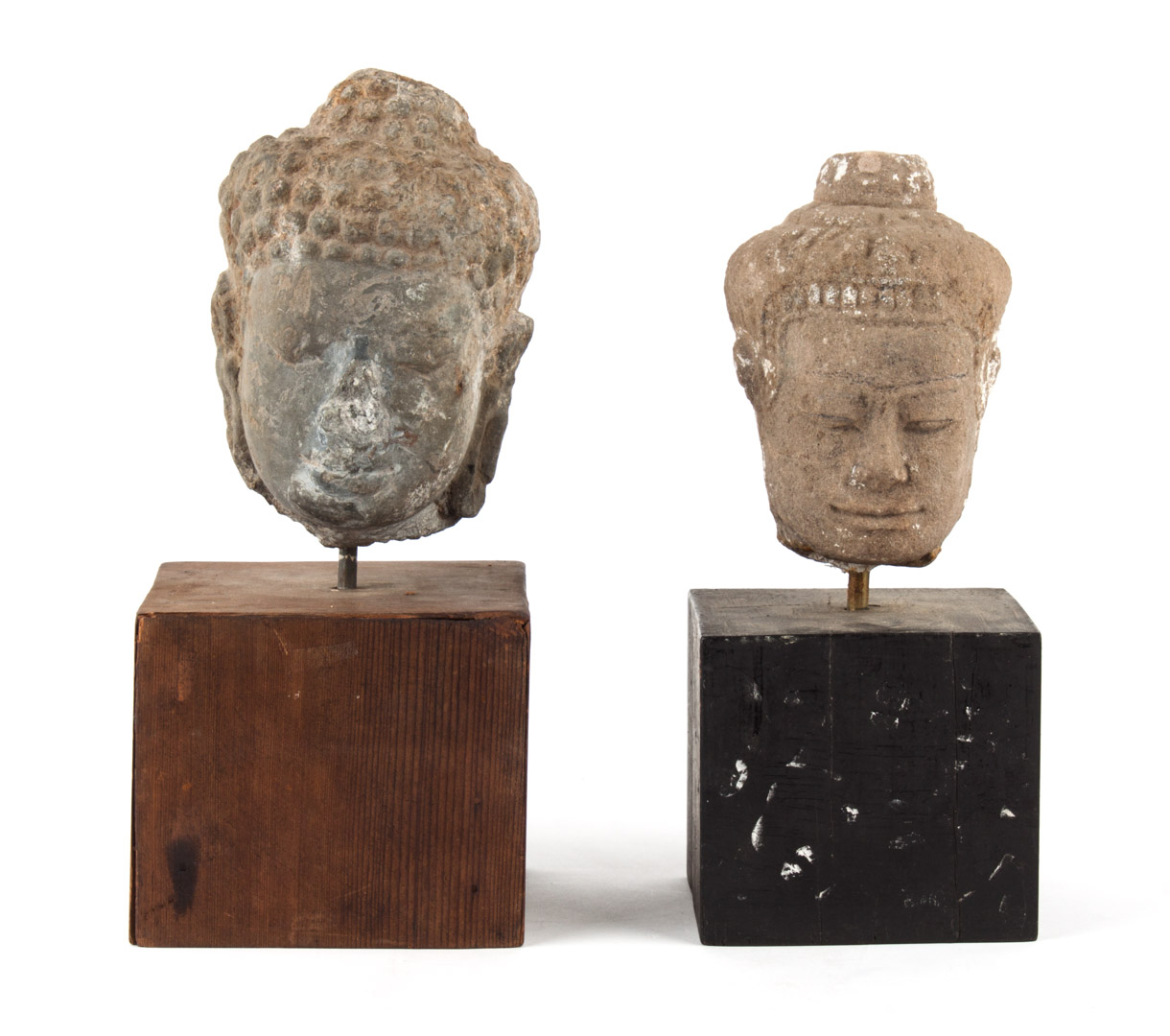 Appraisal: Two Khmer carved stone heads of the Buddha comprising one