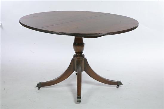 Appraisal: DUNCAN PHYFE STYLE BANQUET TABLE Mahogany oval table with edge