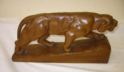 Appraisal: AN ART DECO OAK FIGURE carved as a crouching panther