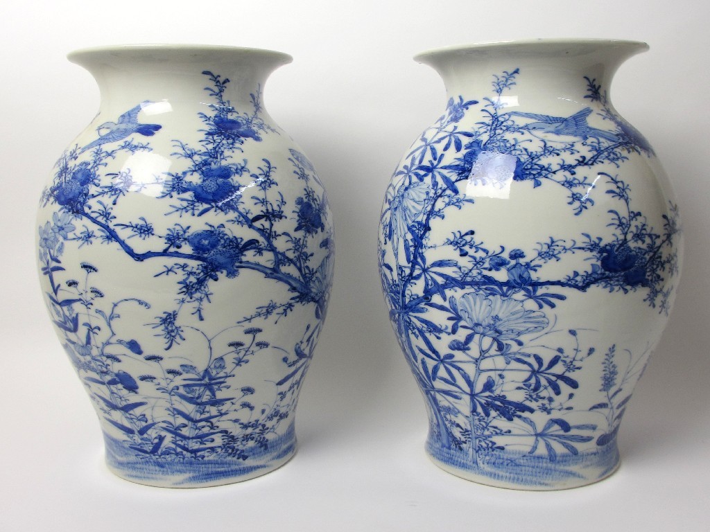 Appraisal: A pair of Japanese blue and white baluster vases painted