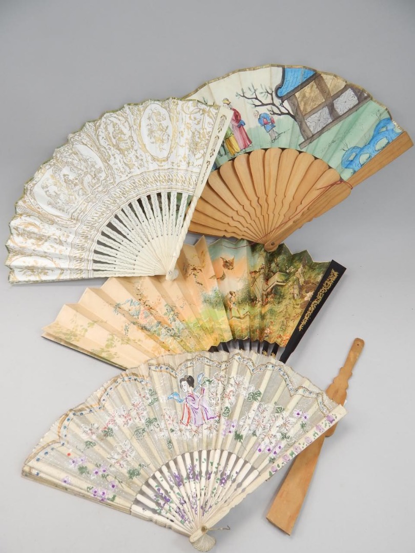 Appraisal: A fan with pierced spokes gilt highlighted and decorated with