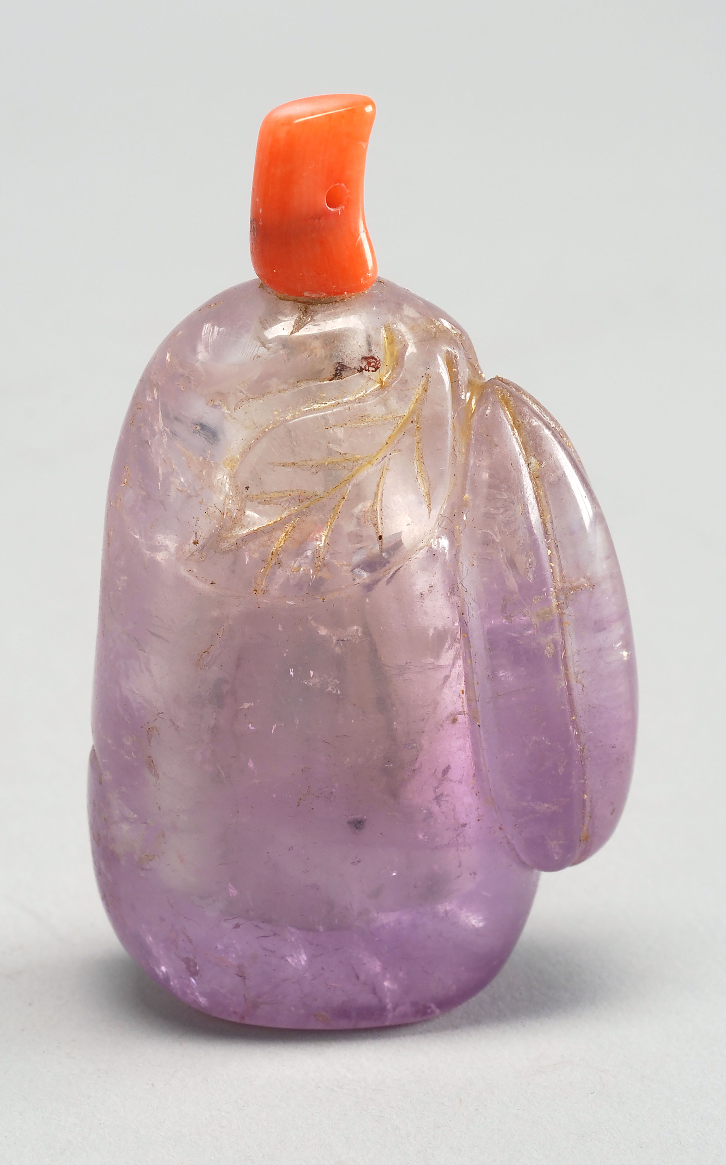 Appraisal: AMETHYST SNUFF BOTTLE Circa In melon form with relief-carved leaves