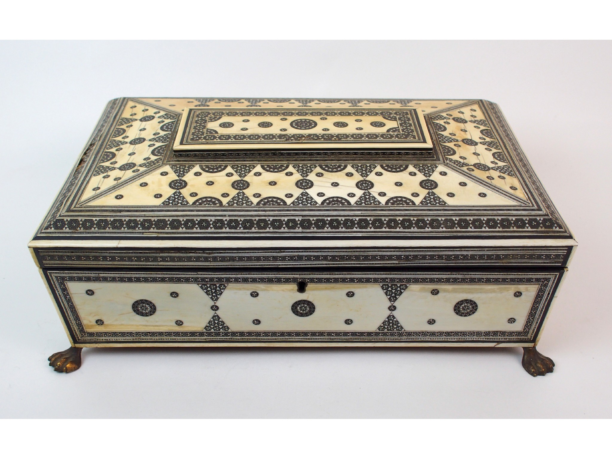 Appraisal: A Vizagapatam ivory sewing boxthe hinged cover enclosing a lift