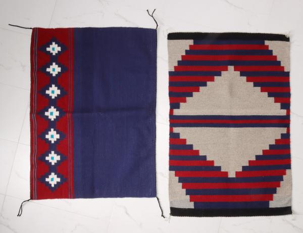 Appraisal: TWO CONTEMPORARY NAVAJO SADDLE BLANKETSThe two clean bright weavings as