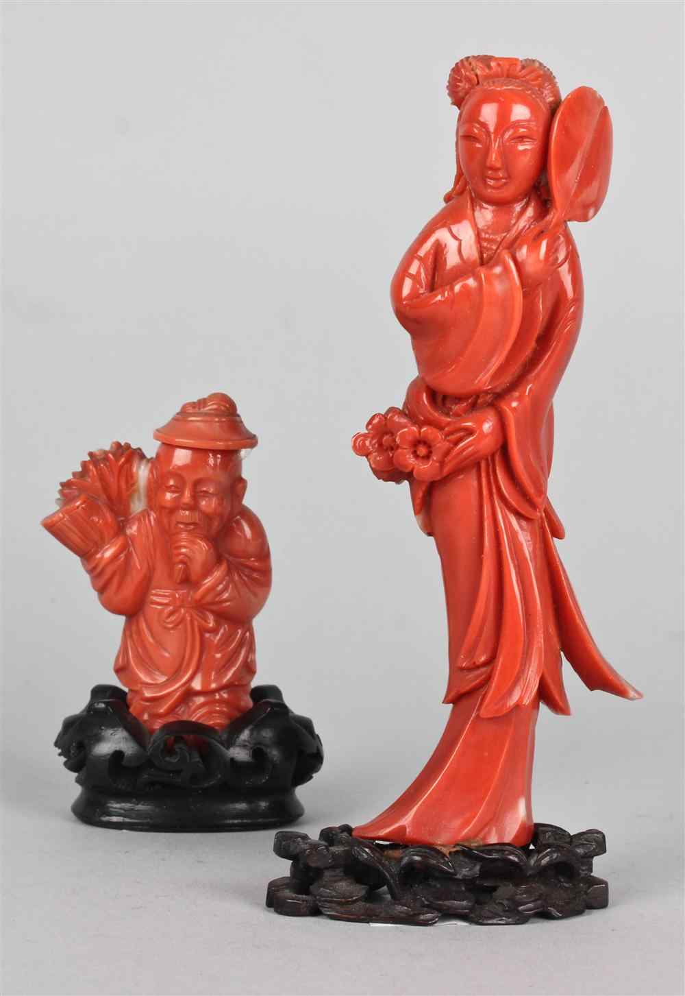 Appraisal: TWO CHINESE CORAL FIGURES the first carved as a Chinese