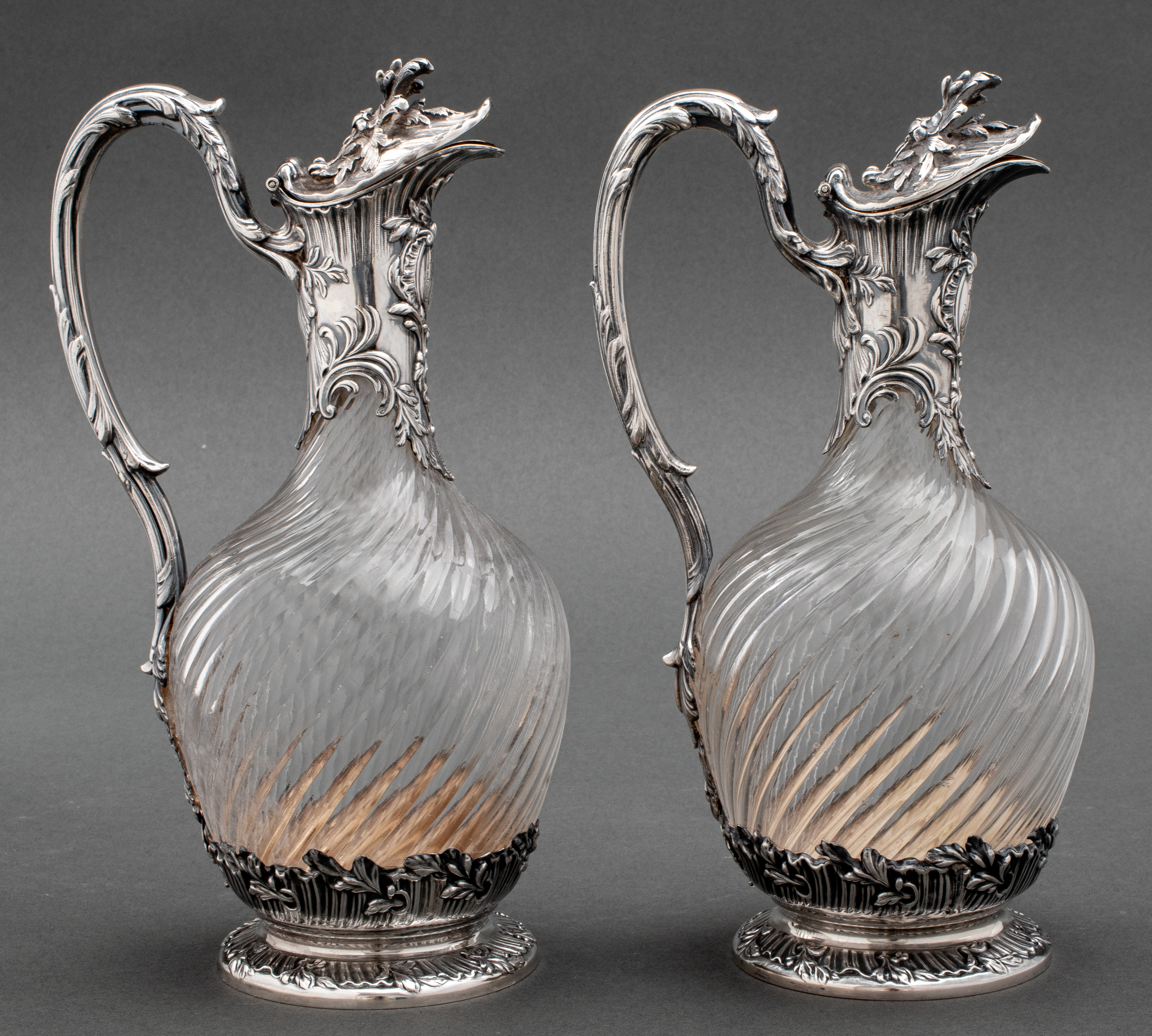 Appraisal: PAIR FRENCH SILVER GLASS WINE EWERS A pair of French