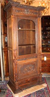 Appraisal: French oak single door bookcase with carved attributes of the