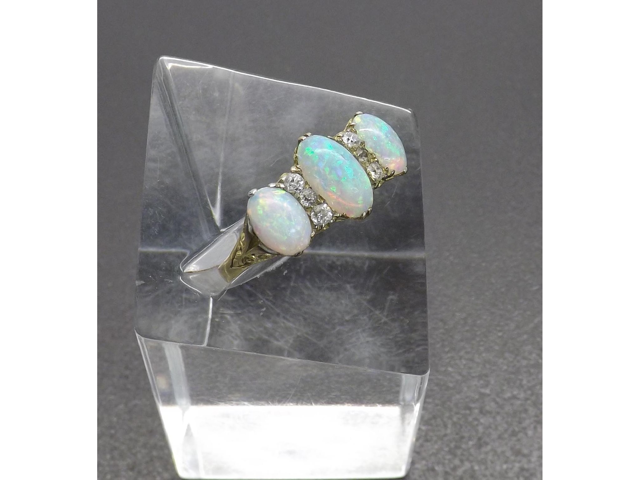 Appraisal: Opal and diamond claw set dress ring with three oval