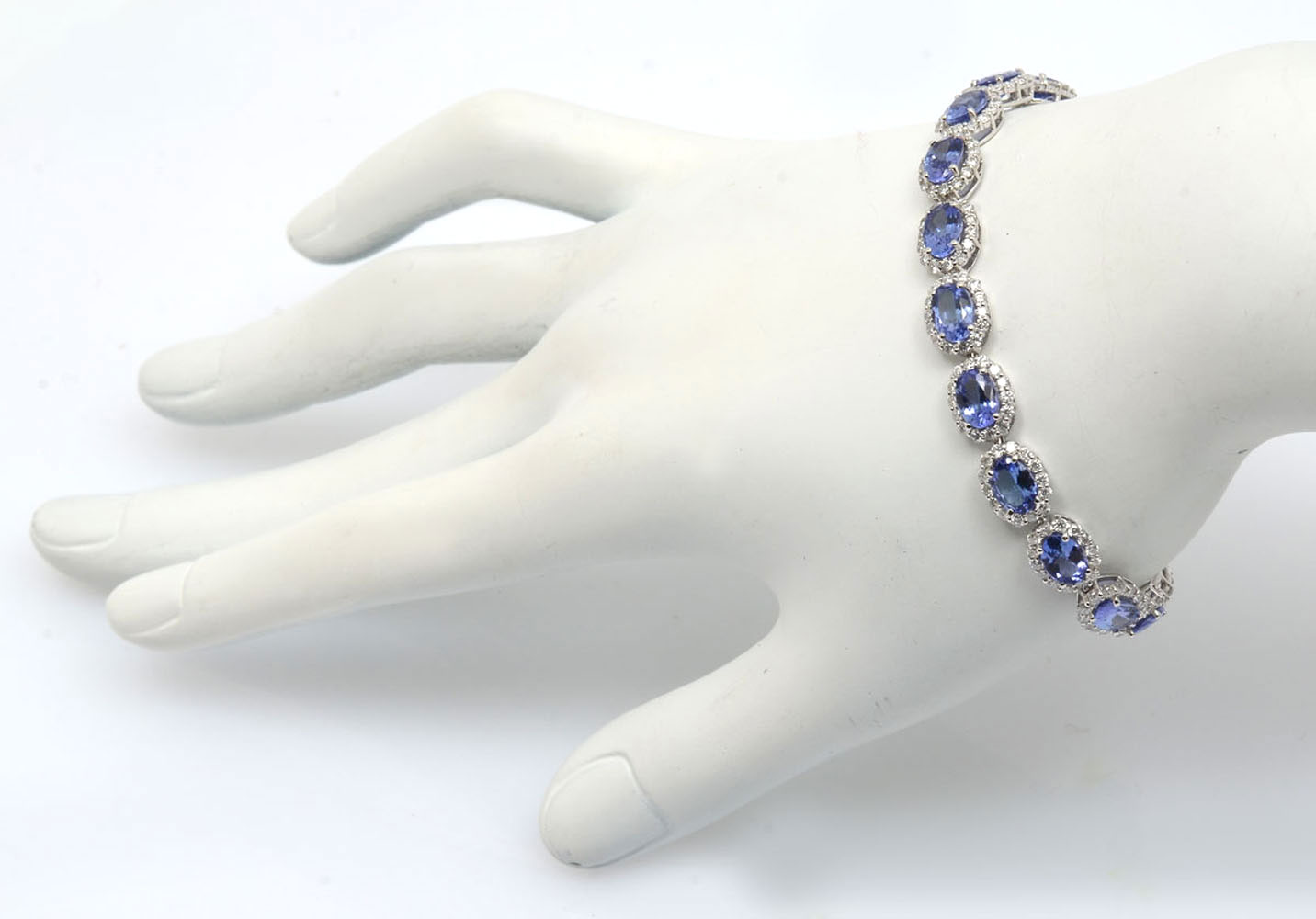 Appraisal: K TANZANITE DIAMOND BRACELET mixed cut natural tanzanites are set