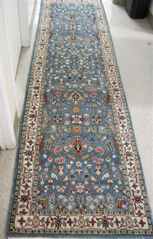 Appraisal: AFGHANI PERSIAN RUNNER overall floral decoration on sky blue ground