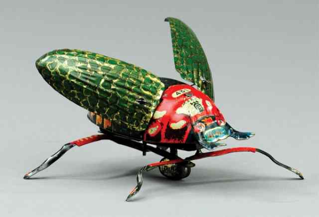 Appraisal: LEHMANN BEETLE Germany lithographed tin clockwork driven very colorful overall