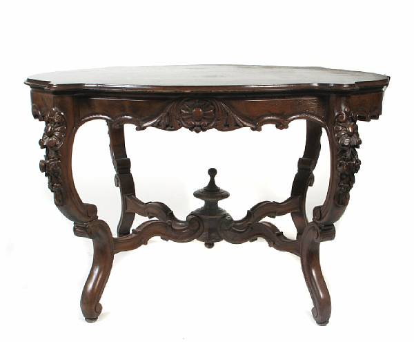 Appraisal: An American Rococo Revival oak center table losses to veneer