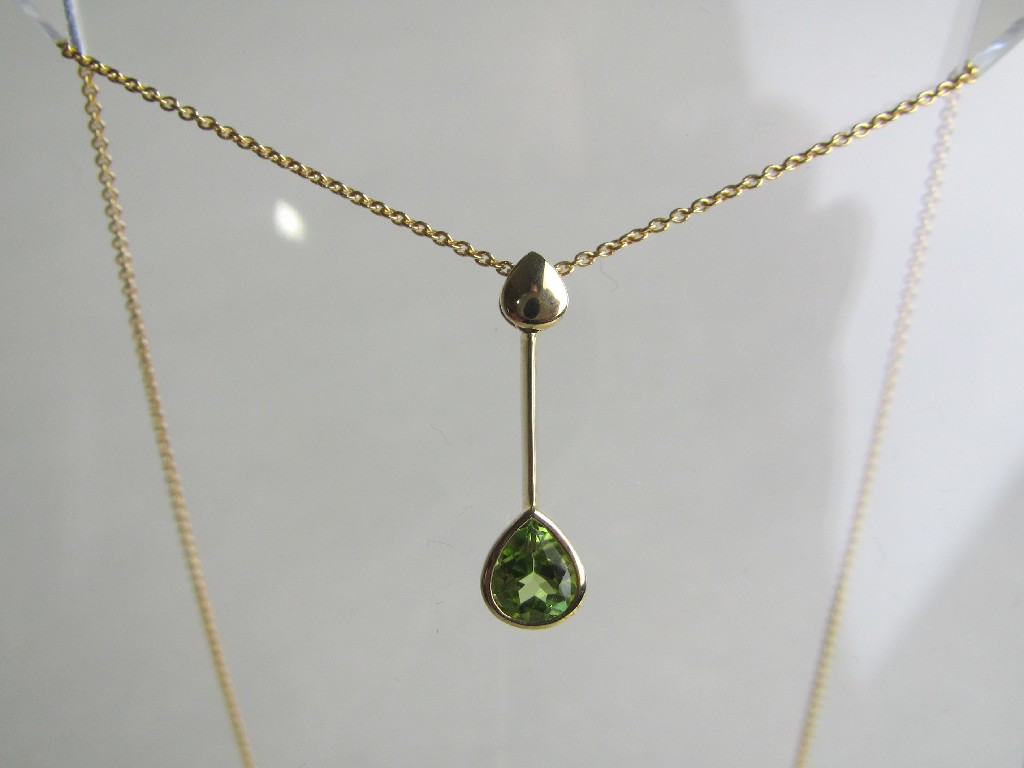 Appraisal: Nine carat gold peridot set pendant on ct gold neckchain