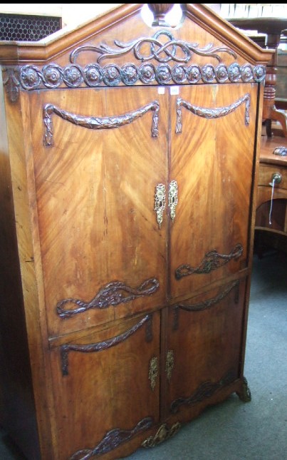 Appraisal: A th century mahogany side cabinet the urn mounted broken