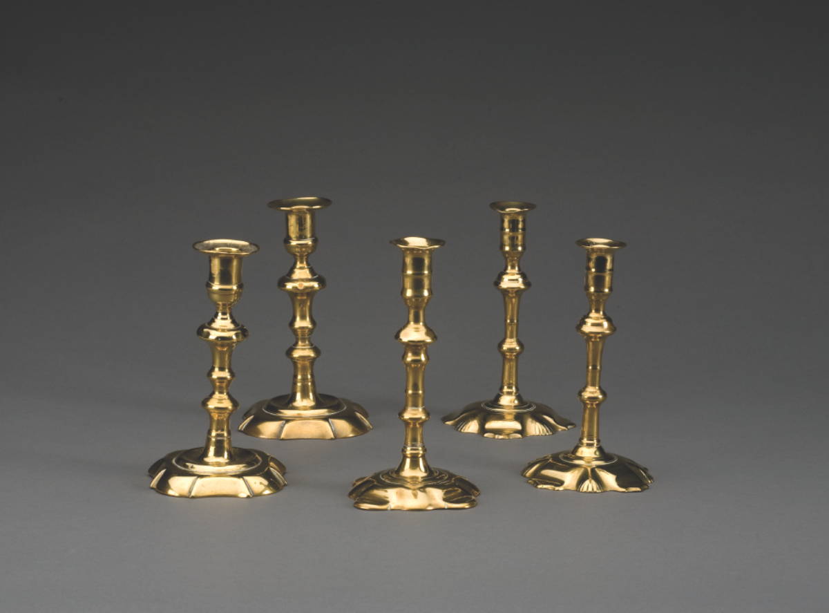 Appraisal: GROUP OF GEORGIAN BRASS CANDLESTICKS Comprising a matched pair each