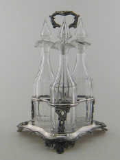 Appraisal: A set of three panel cut glass spirit decanters with