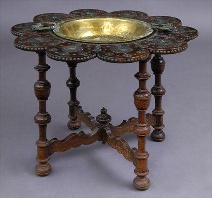 Appraisal: BAROQUE-STYLE BRASS-MOUNTED WALNUT BRAZIER STAND The -lobed top fitted with